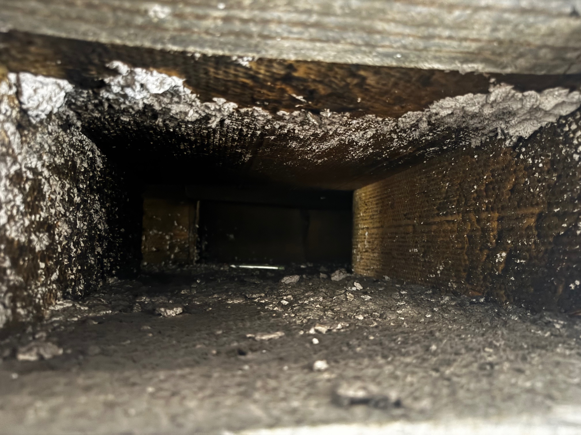 Before cleaning — return duct full of dust and debris