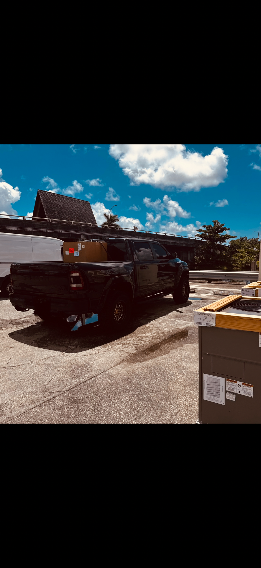Cool Logix truck picking up a new AC unit — ready for install day